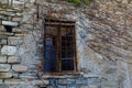 An old window in a stone house on a street in Varenna, a small town on lake Como, Italy Royalty Free Stock Photo