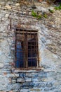 An old window in a stone house on a street in Varenna, a small town on lake Como, Italy Royalty Free Stock Photo
