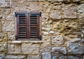 Old window in a stone wall. Malta Royalty Free Stock Photo