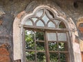 Old window with terra-cotta tiled roof. An architectural details from Goa, India. Royalty Free Stock Photo