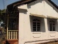 old window with terra-cotta tiled roof. An architectural details from Goa, India.