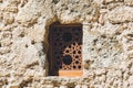 An old window on the wall of an old fortress Royalty Free Stock Photo