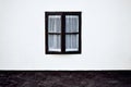 Old window in a white wall Royalty Free Stock Photo