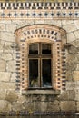 Old window with wooden frame and old stone facade Royalty Free Stock Photo