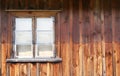 The old window in the wooden gouse wall Royalty Free Stock Photo