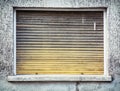 Old window with wooden roller blind Royalty Free Stock Photo