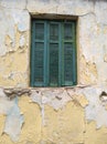 old window wooden shutters with flaking facade Royalty Free Stock Photo