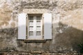 Old window with wooden white painted open shutters Royalty Free Stock Photo