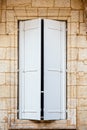 Old window with wooden white painted shutters Royalty Free Stock Photo