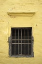 The old window on yellow wall Royalty Free Stock Photo