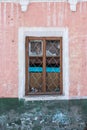 Old Windows with broken glass and broken frames in the old house. Royalty Free Stock Photo