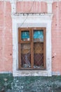 Old Windows with broken glass and broken frames in the old house. Royalty Free Stock Photo
