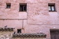 Old windows in a facade painted pink, Cuenca