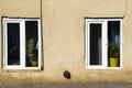 Old windows, house facade and sunlight Royalty Free Stock Photo