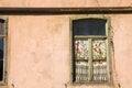 Old windows, house facade and sunlight Royalty Free Stock Photo