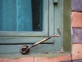 Old windows latch  and wooden window Royalty Free Stock Photo