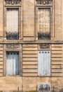 Old windows on ruin house