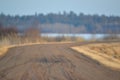 Old windy dirt / gravel road in the Crex Meadows Wildlife Area in Northern Wisconsin in late winter / early spring