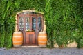 Wine barrels outside a vine covered restaurant in Italy Royalty Free Stock Photo