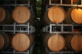 Old wine barrels in a wine cellar. Stacked Wine barrels at the winery. Whisky casks in old cellar. Royalty Free Stock Photo