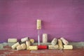 Old wine corks in a row, grungy background