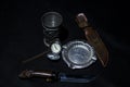 An old wine glass, an ashtray, a knife and a watch is the props of a real hunter Royalty Free Stock Photo
