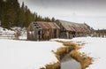 Old Winter Barn with Stream Royalty Free Stock Photo