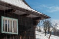 Old winter chalet in Czech Republic with snow melting