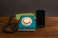 an old wired phone and a smartphone Royalty Free Stock Photo