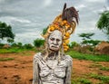 Old woman from the african tribe Mursi in her village Royalty Free Stock Photo