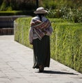 Old woman in andes town village Achoma wearing traditional indigenous handwoven colorful dress costume Colca Canyon Peru