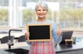 old woman in apron with menu showing thumbs up Royalty Free Stock Photo