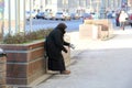 Old woman begging