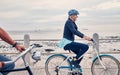 Old woman on bike at beach, fitness and cycling outdoor, vitality and health, retirement activity by ocean. Cyclist Royalty Free Stock Photo