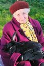 Old woman with black rabbit