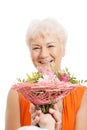 An old woman with bouquet of flowers. Royalty Free Stock Photo