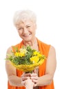 An old woman with bouquet of flowers. Royalty Free Stock Photo