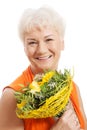 An old woman with bouquet of flowers. Royalty Free Stock Photo