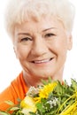 An old woman with bouquet of flowers. Royalty Free Stock Photo