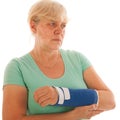 Old woman with broken wrist in gypsum Royalty Free Stock Photo