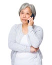 Old woman chat on mobile phone Royalty Free Stock Photo