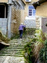 An old woman climbing the stairs Royalty Free Stock Photo