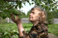The old woman considers pear flowers