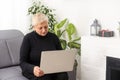 old woman does online shopping