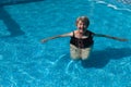 Senior woman doing exercises in a pool Royalty Free Stock Photo