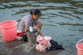 Old woman doing laundry in Fenghuang