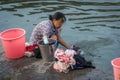 Old woman doing laundry in Fenghuang