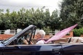 Old woman driving a convertible Royalty Free Stock Photo