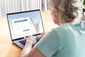 Old woman and elder senior using laptop. Online form to register data. Patient information to health care website. Royalty Free Stock Photo