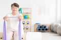 Old woman exercising at gym